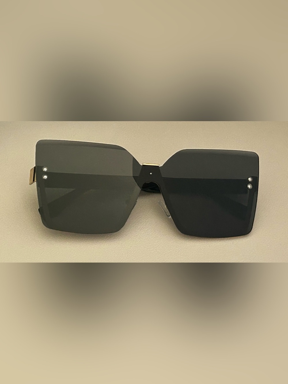 Rimless Black Shield Sunglasses with Gold Accent
